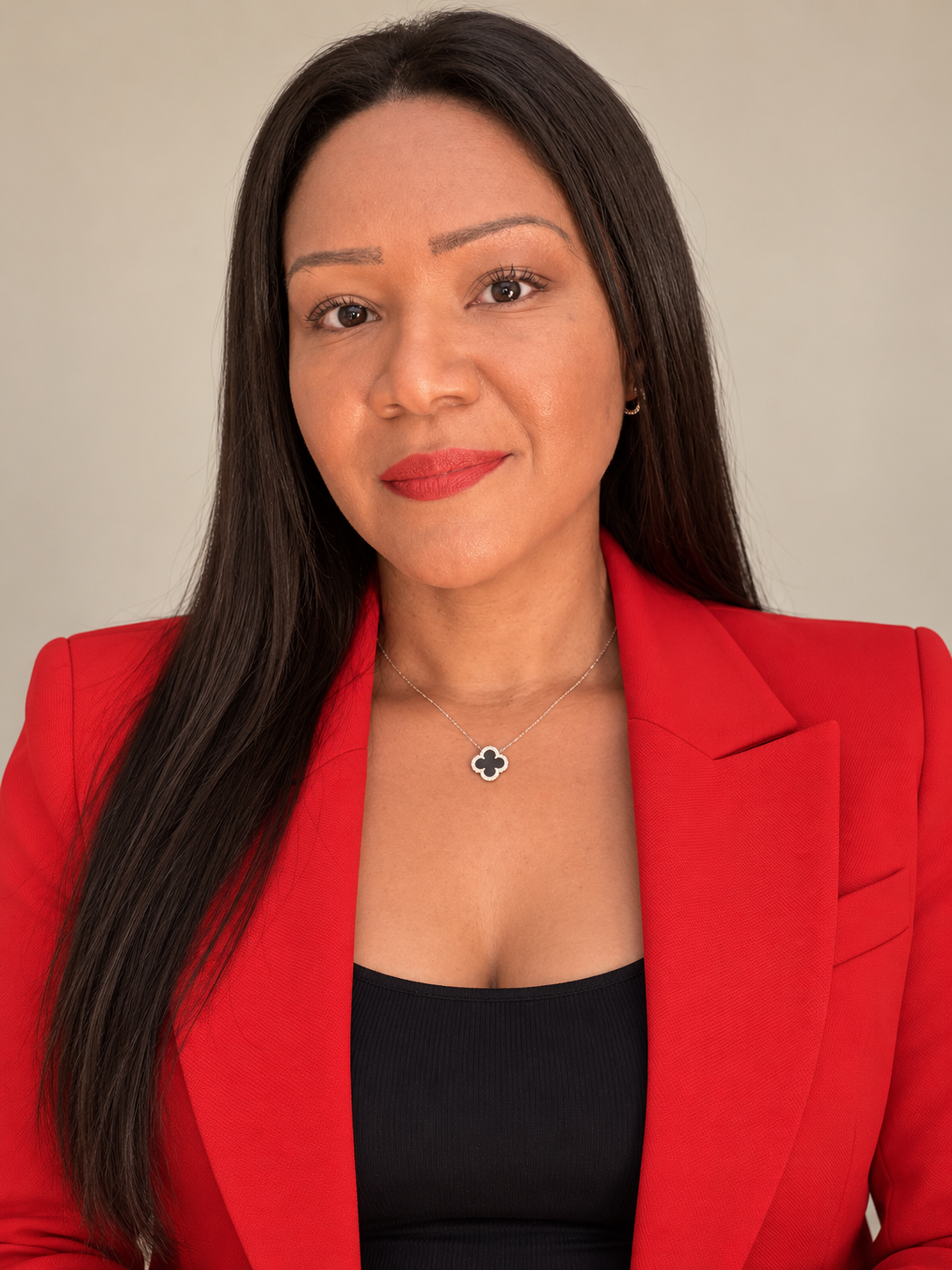 Janelle, founder of J.Dallis, in a red blazer